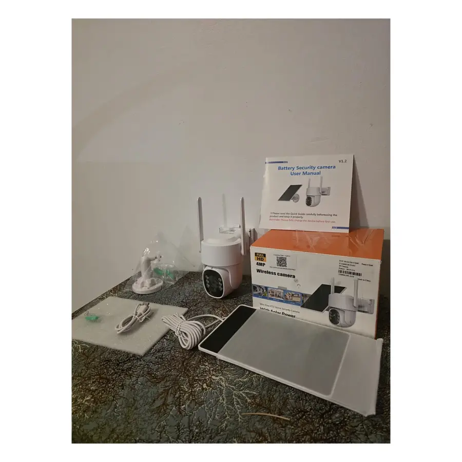 Open Box white 4MP PTZ wireless solar security camera with its solar panel, mounting bracket, USB cable, user manual and retail box