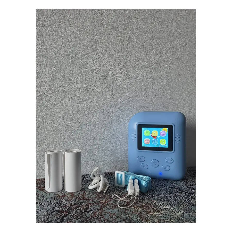 Open Box blue kids instant print camera with colour menu screen, two thermal paper rolls, USB cable and neck strap