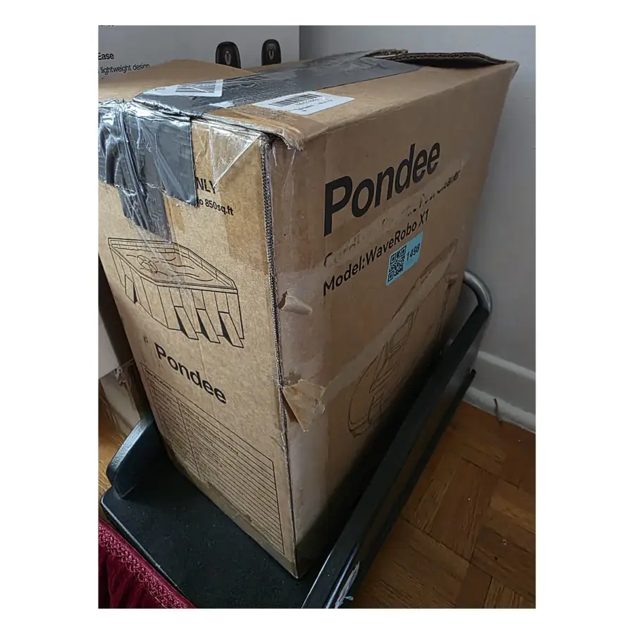 Pondee WaveRobo X1 cordless robotic pool cleaner in its original cardboard box with the model label