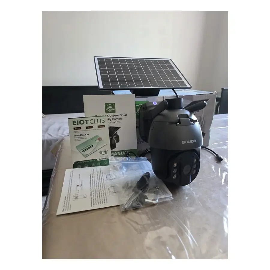 Open Box SOLIOM S600-4G solar security camera with its solar panel, EIOTCLUB SIM card kit, mounting hardware, manuals and original box